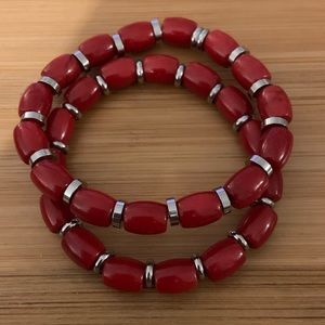 Pair of Red coral stretch bracelets with stainless steel accents throughout.New!